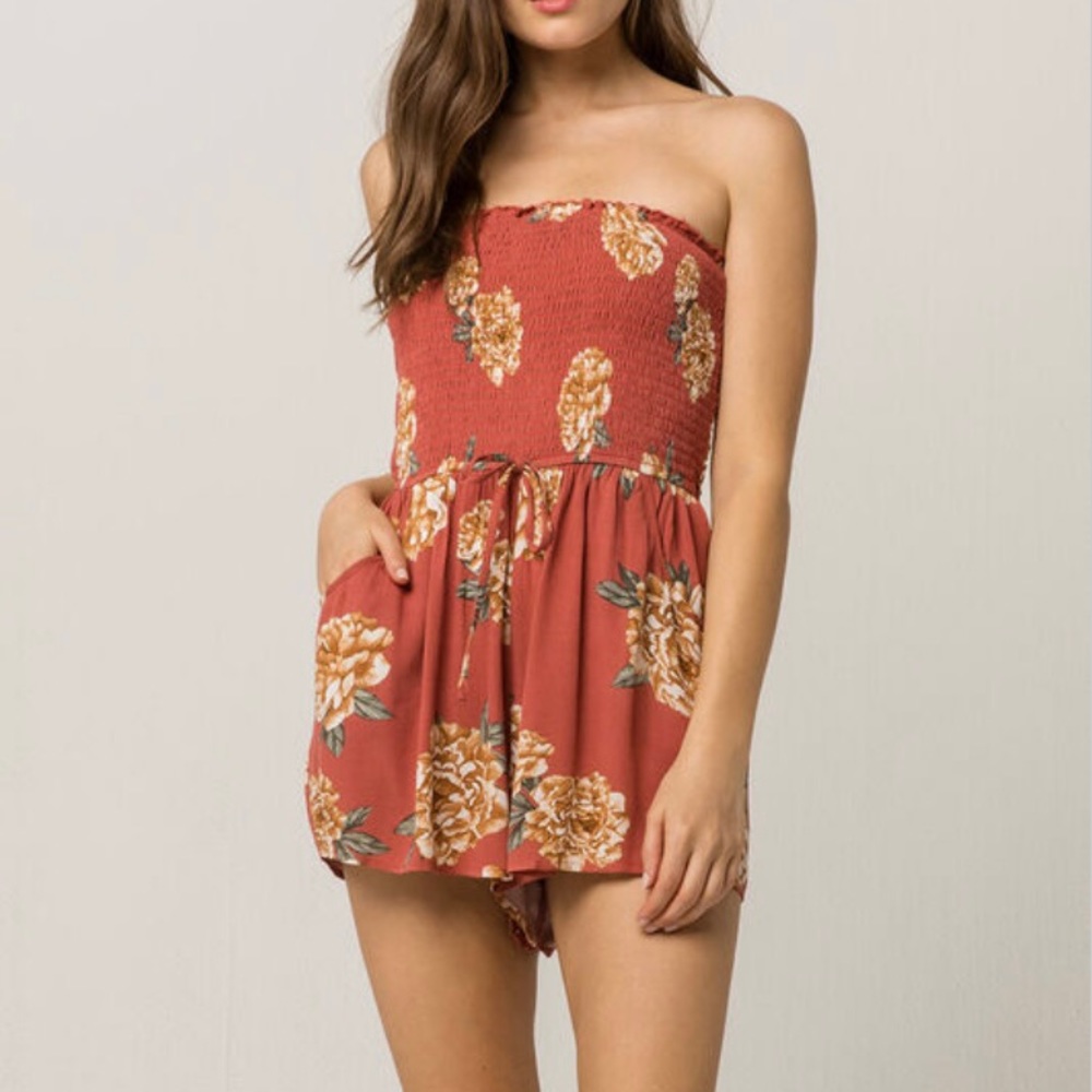 Tilly’s orange floral smocked strapless romper